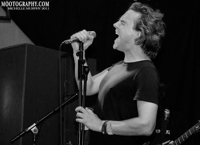 Sam on stage during a rock performance