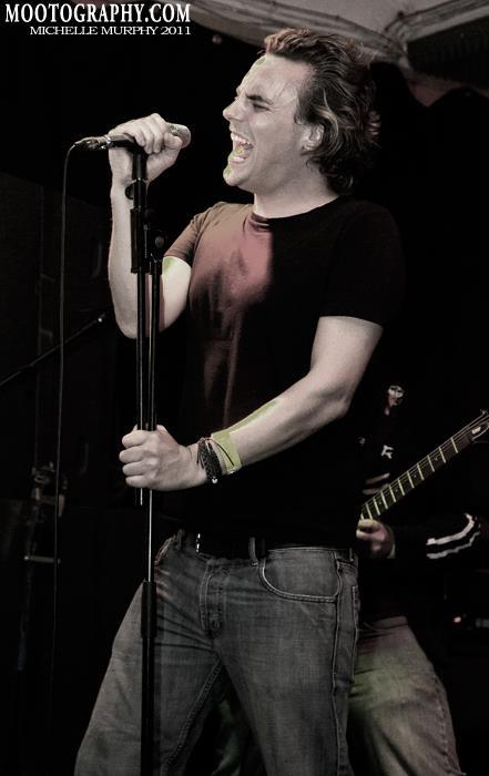 Sam singing with his band around 2011